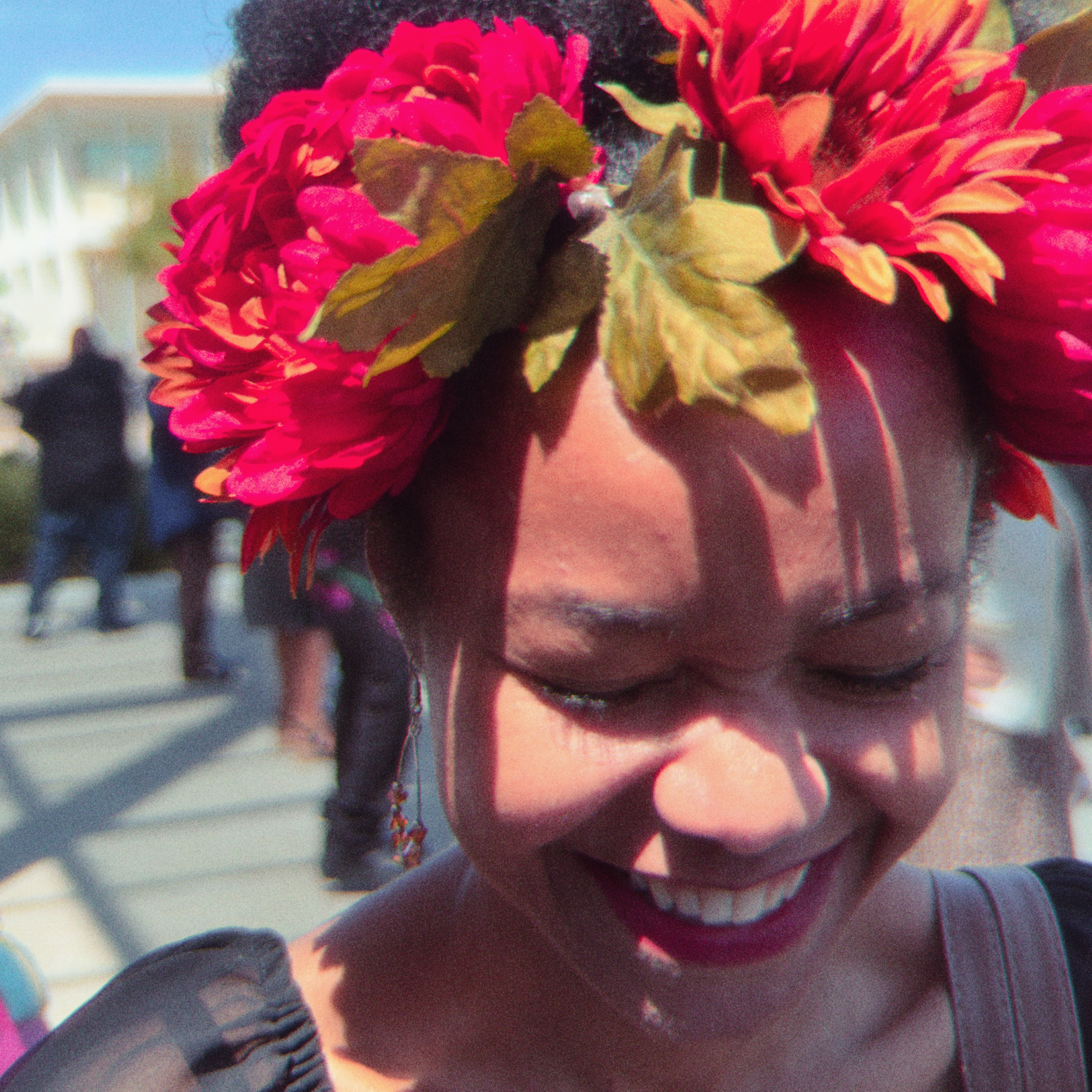 joyous black woman with flower crown, smiling